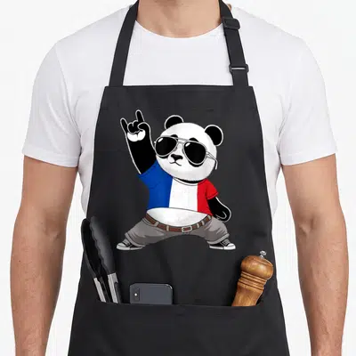 Tablier de cuisine noir avec illustration d'un panda rockeur portant un haut aux couleurs du drapeau français et des lunettes noires.