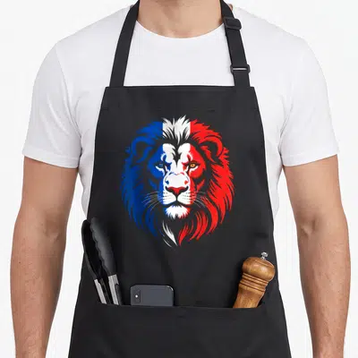 Tablier de cuisine noir avec tête de lion aux couleurs du drapeau français bleu blanc rouge.