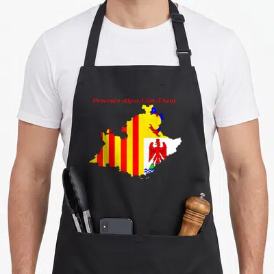 Tablier de cuisine noir avec carte colorée de la région Provence-Alpes-Côte d'Azur et ses emblèmes heraldiques imprimés au centre.