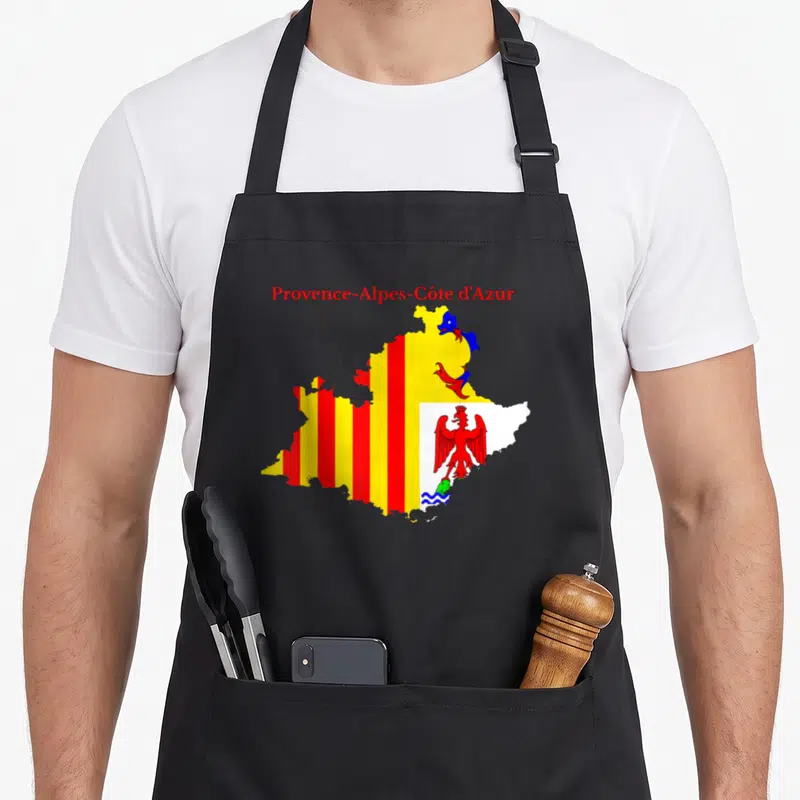 Tablier de cuisine noir avec carte colorée de la région Provence-Alpes-Côte d'Azur et ses emblèmes heraldiques imprimés au centre.