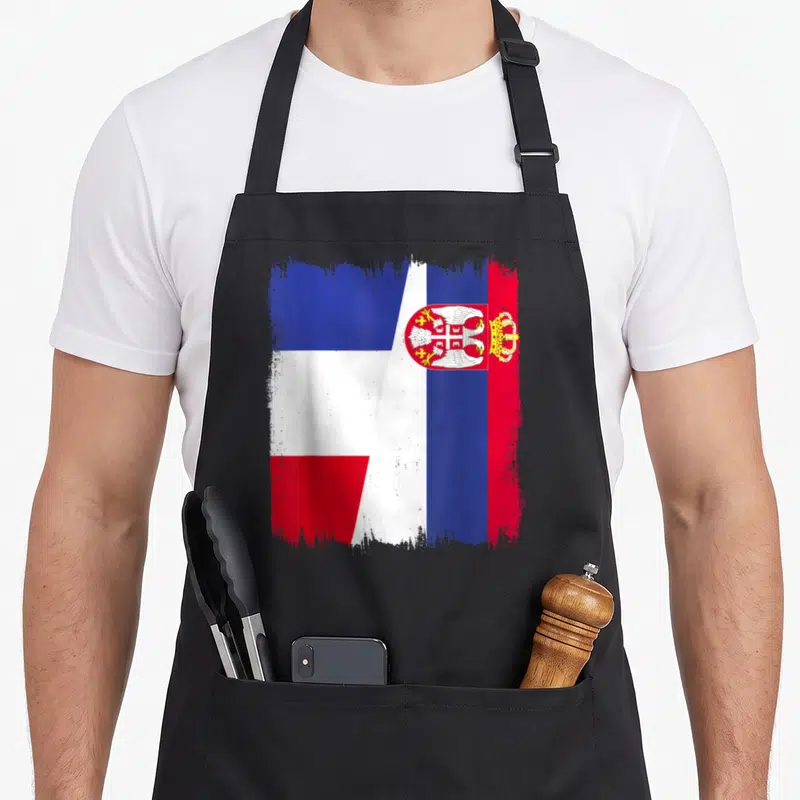 Tablier de cuisine noir avec un demi-drapeau France Serbie stylisé aux couleurs vives et à l'aigle bicéphale.
