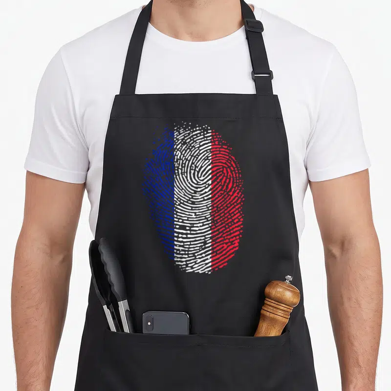 Tablier de cuisine noir avec une grande empreinte digitale aux couleurs bleu blanc rouge du drapeau français.
