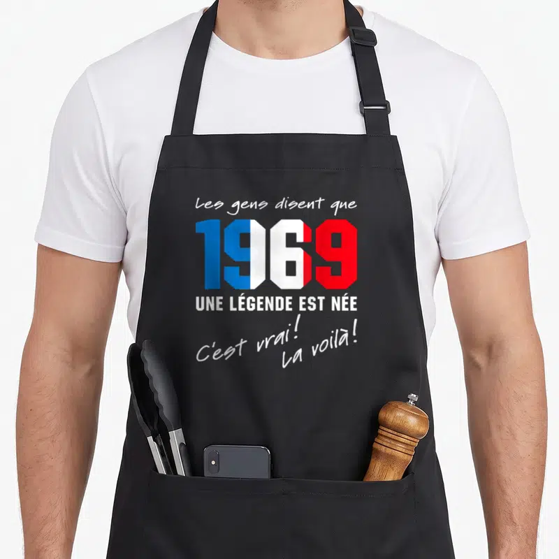 Tablier de cuisine noir avec 1969 aux couleurs du drapeau français et texte blanc Les gens disent que une légende est née c'est vrai la voilà