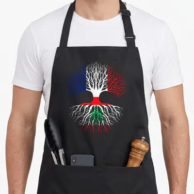 Tablier de cuisine noir avec un arbre aux branches bleues blanches rouges et racines vertes sur fond blanc.