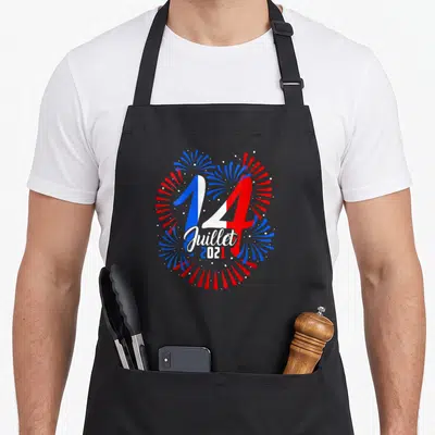 Tablier de cuisine noir avec le 14 Juillet 2021 et des feux d'artifice tricolores français.