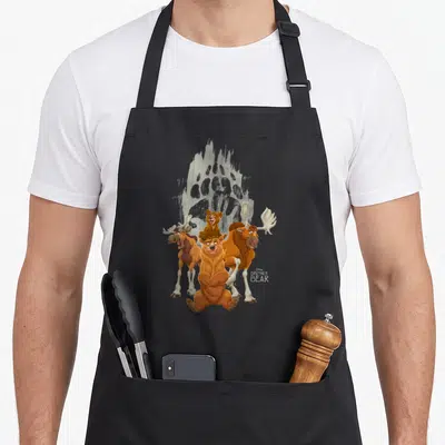 Tablier de cuisine noir avec Koda, Tuke, Kuken et une grande empreinte de patte en arrière-plan.