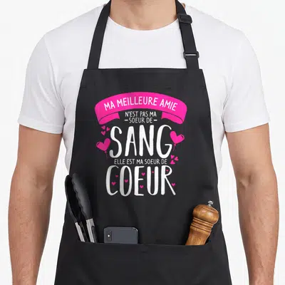 Tablier de cuisine noir avec inscription rose et blanche sur le thème de la sœur de cœur et des amies proches.