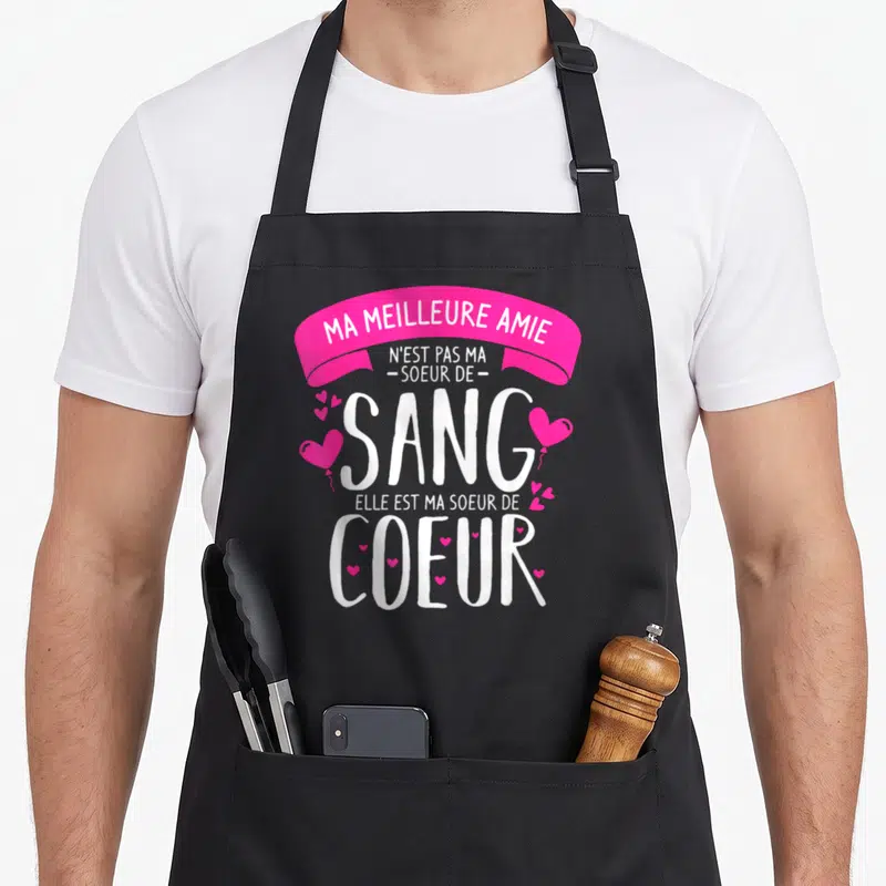 Tablier de cuisine noir avec inscription rose et blanche sur le thème de la sœur de cœur et des amies proches.