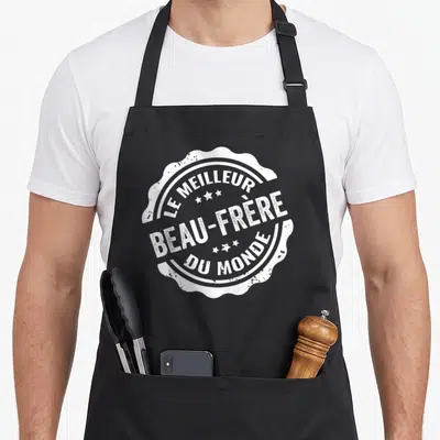Tablier de cuisine noir avec un logo circulaire blanc style cachet portant l'inscription Le Meilleur Beau-Frère Du Monde.