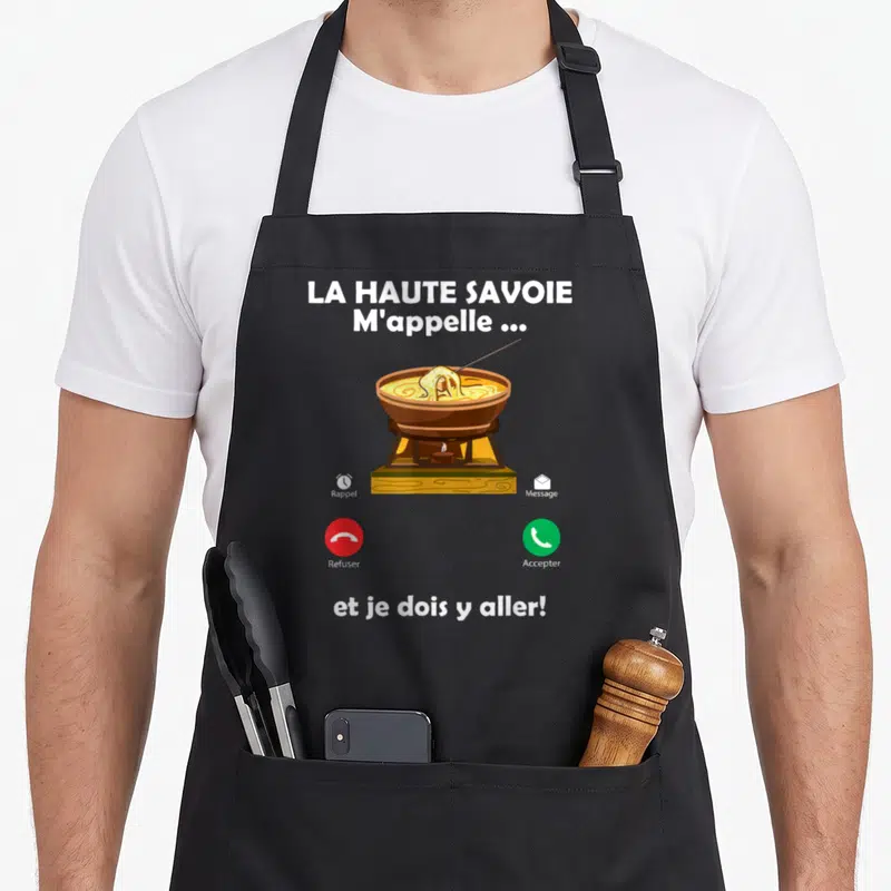 Tablier de cuisine noir avec illustration de fondue savoyarde et boutons dappel téléphonique rouge et vert sur fond gris uni.