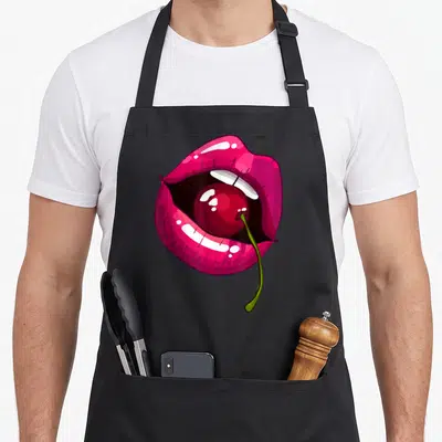 Tablier de cuisine noir avec illustration de lèvres roses tenant une cerise rouge à la tige verte.