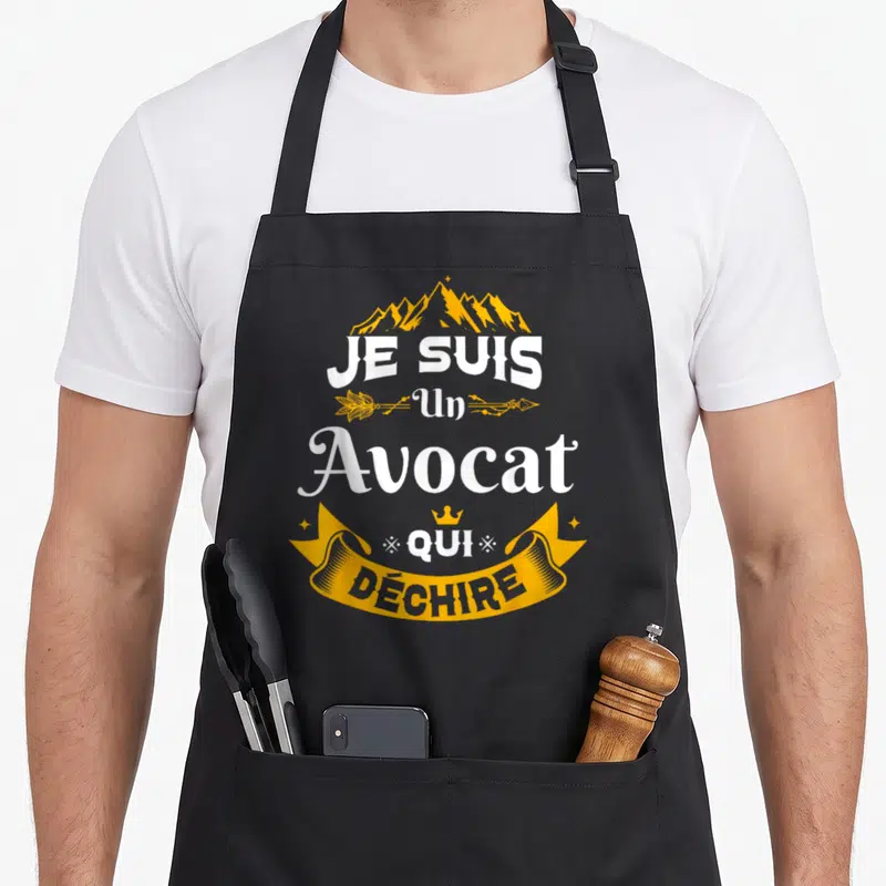 Tablier de cuisine noir avec inscription Je Suis Un Avocat Qui Déchire en blanc et jaune.