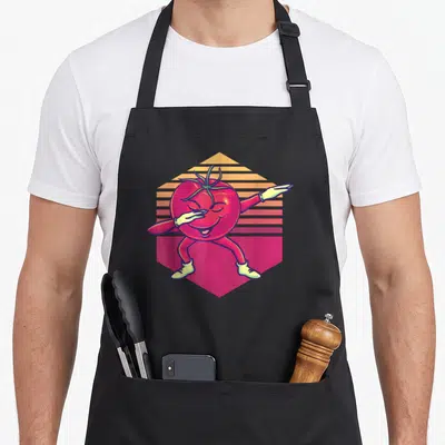 Tablier de cuisine noir avec une tomate rouge anthropomorphique effectuant un mouvement de danse sur fond géométrique coloré.