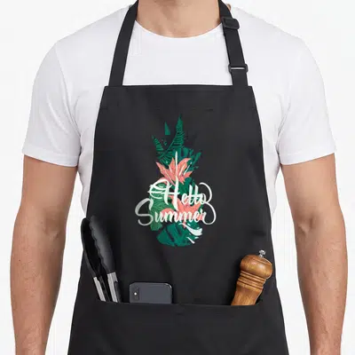 Tablier de cuisine noir avec illustration d'ananas tropical et texte « Hello Summer Beach Ananas Ambiances » en blanc.