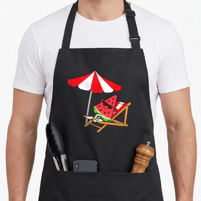 Tablier de cuisine noir avec une pastèque relaxante et relaxante sous parasol rouge et blanc.