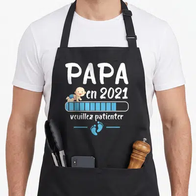 Tablier de cuisine noir avec Papa en 2021 veuillez patienter et illustration de bébé.
