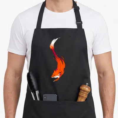 Tablier de cuisine noir avec illustration artistique d'un bébé renard aux teintes orangées et blanches, style aquarelle dynamique.