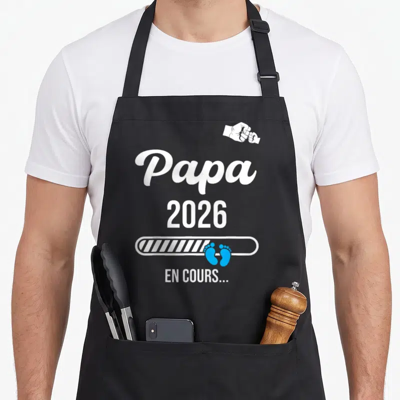 Tablier de cuisine noir avec texte Papa 2026 en cours et icône poings se touchant
