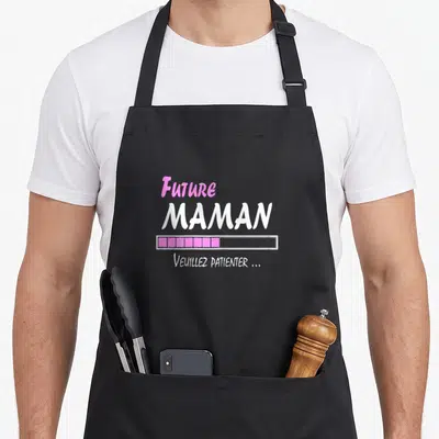 Tablier de cuisine noir avec inscription Future Maman en rose et blanc, barre de progression et texte Veuillez patienter...