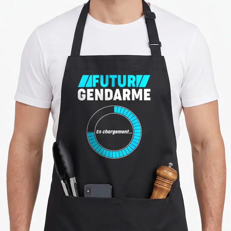 Tablier de cuisine noir avec inscription Futur Gendarme et icône de chargement circulaire bleue et blanche sur le devant.