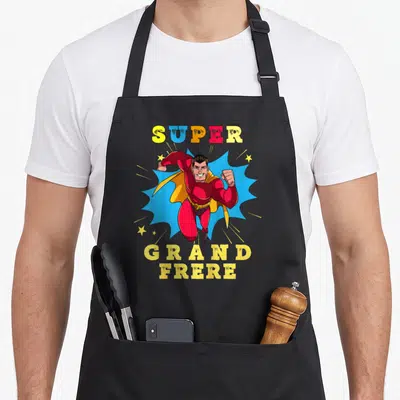 Tablier de cuisine noir avec illustration super-héros Super Grand Frère 2027 en couleurs vives.