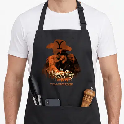 Tablier de cuisine noir avec illustration orange Rip Wheeler Beth Dutton et texte I'm Nobody's Baby Yellowstone
