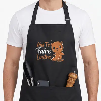 Tablier de cuisine noir avec une illustration de loutre et le texte Vas Te Faire Loutre en orange et blanc.