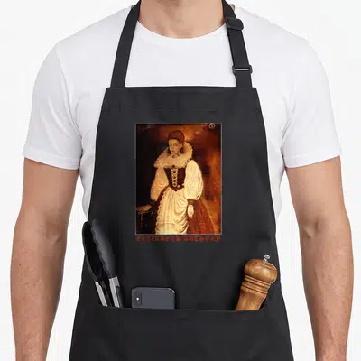 Tablier de cuisine noir avec portrait d'Elizabeth Bathory en col blanc et texte rouge en bas.