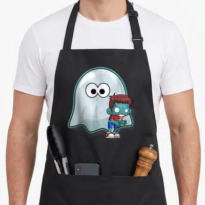 Tablier de cuisine noir avec illustration d'un fantôme Boowy et d'un zombie vert aux yeux blancs.