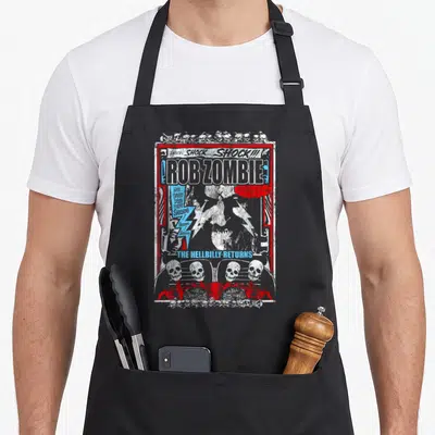 Tablier de cuisine noir avec illustration gothique Rob Zombie, squelettes rouges et texte shock en blanc et bleu.