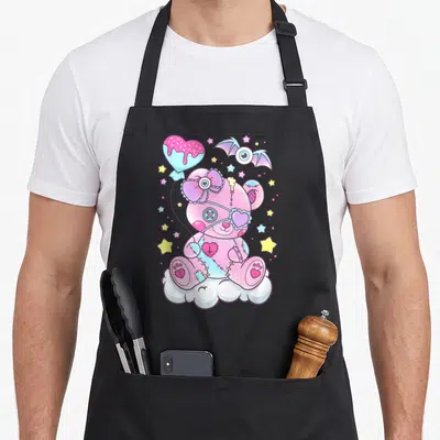 Tablier de cuisine noir avec ours mignon effrayant rose pastel, étoiles et ballon en forme de cœur.