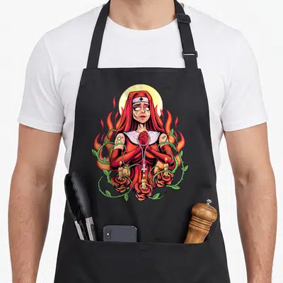 Tablier de cuisine noir avec illustration d'une sœur satanique entourée de roses et de flammes rouges.