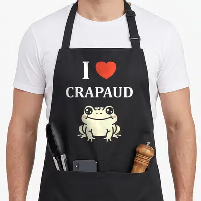 Tablier de cuisine noir avec inscription I love Crapaud et dessin de crapaud souriant aux joues roses.