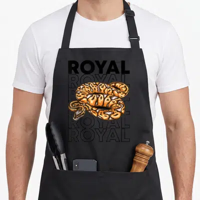 Tablier de cuisine noir avec illustration d'un python royal orange et texte royal en arrière-plan.