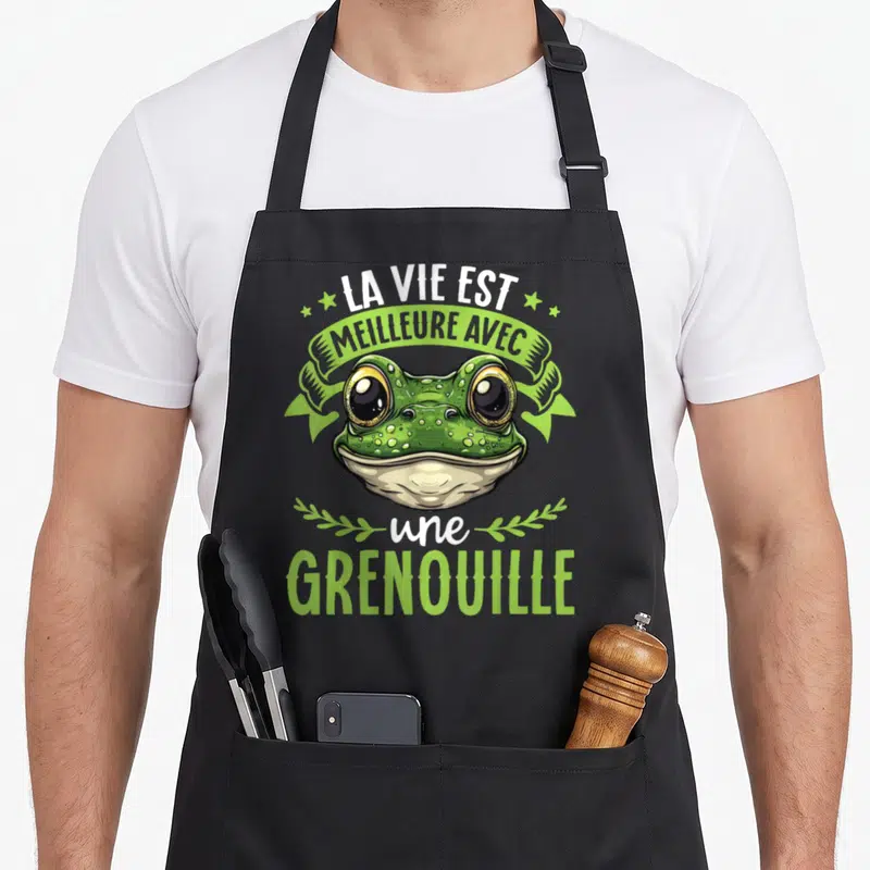 Tablier de cuisine noir avec illustration d'une grenouille verte et le texte La vie est meilleure avec une grenouille.