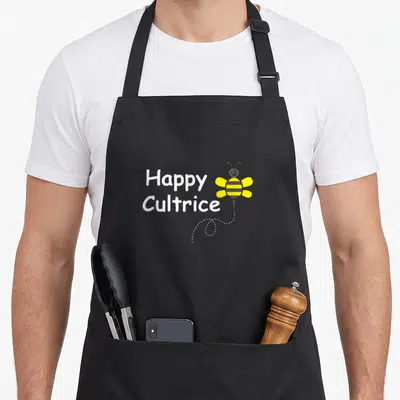 Tablier de cuisine noir avec inscription Happy Cultrice et illustration d'abeille jaune souriante en vol.