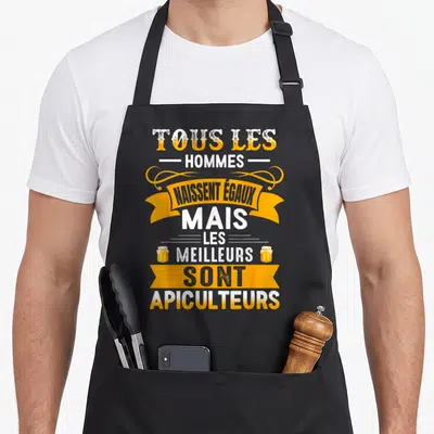 Tablier de cuisine noir avec inscription blanche et orange sur le thème des apiculteurs et des jarres de miel.