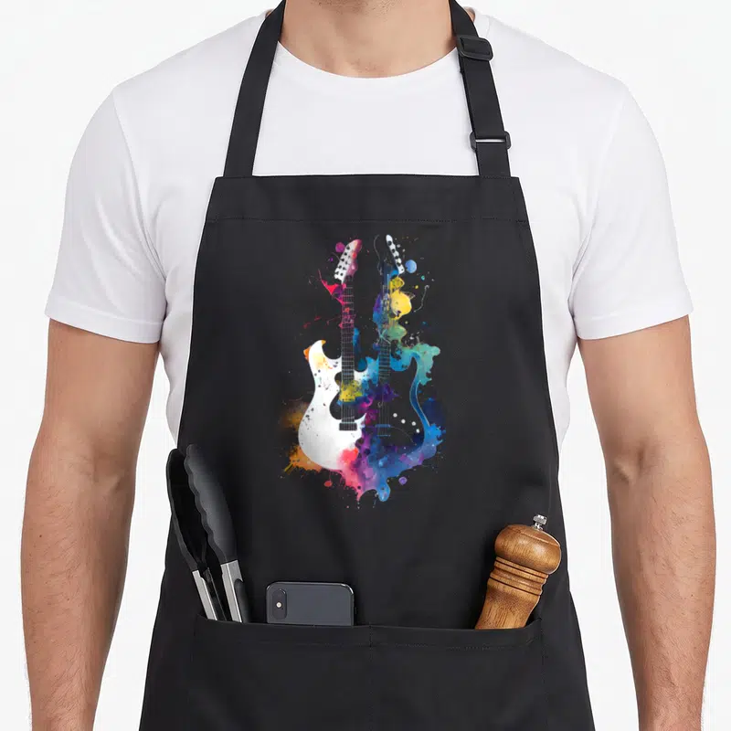 Tablier de cuisine noir avec illustration artistique de deux guitares électriques aux couleurs vives et éclaboussures artistiques.