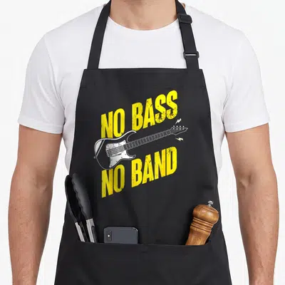 Tablier de cuisine noir avec inscription jaune No Bass No Band et dessin de guitare basse blanche.