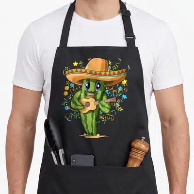 Tablier de cuisine noir avec un cactus vert en sombrero jouant d'une guitare acoustique entouré de confettis colorés.