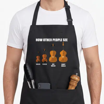 Tablier de cuisine noir avec illustration de quatre violons de taille croissante et texte blanc « How Other ».