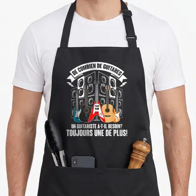 Tablier de cuisine noir avec illustration de cinq guitares et texte sur les enceintes acoustiques