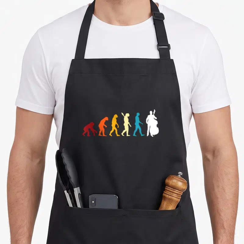 Tablier de cuisine noir avec silhouette évolutive colorée se transformant en joueur de contrebasse blanche.
