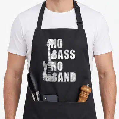 Tablier de cuisine noir avec l'inscription No Bass No Band et une guitare électrique blanche stylisée sur le devant.