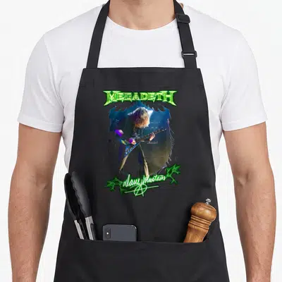 Tablier de cuisine noir avec illustration de Dave Mustaine jouant de la guitare sous les projecteurs.