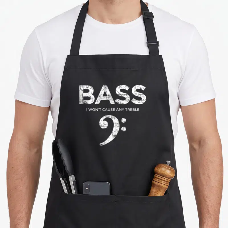 Tablier de cuisine noir avec inscription BASS et clef de fa blanche style vintage délavé.
