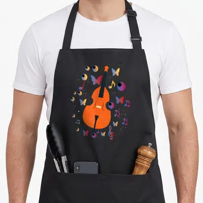Tablier de cuisine noir avec contrebasse orange, papillons et notes de musique colorées.