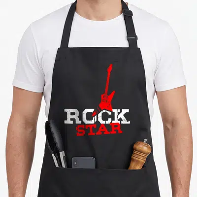 Tablier de cuisine noir avec une electric guitar rouge et le texte ROCK STAR en lettres blanches et rouges.