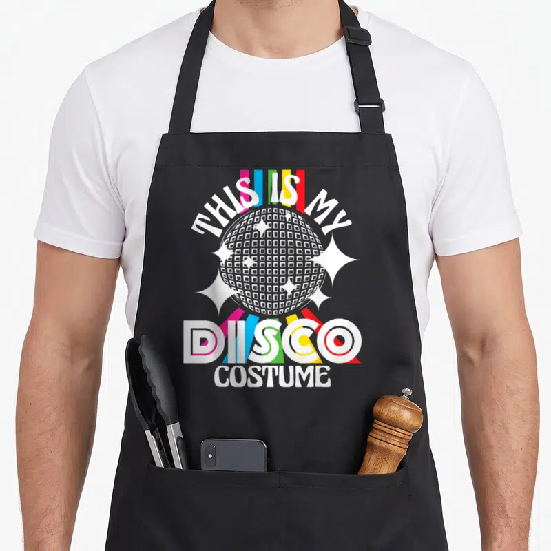 Tablier de cuisine noir avec disco ball et texte This Is My Disco Costume coloré.