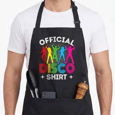 Tablier de cuisine noir avec cinq silhouettes multicolores dansant sous le texte Official Disco Shirt en lettres blanches.